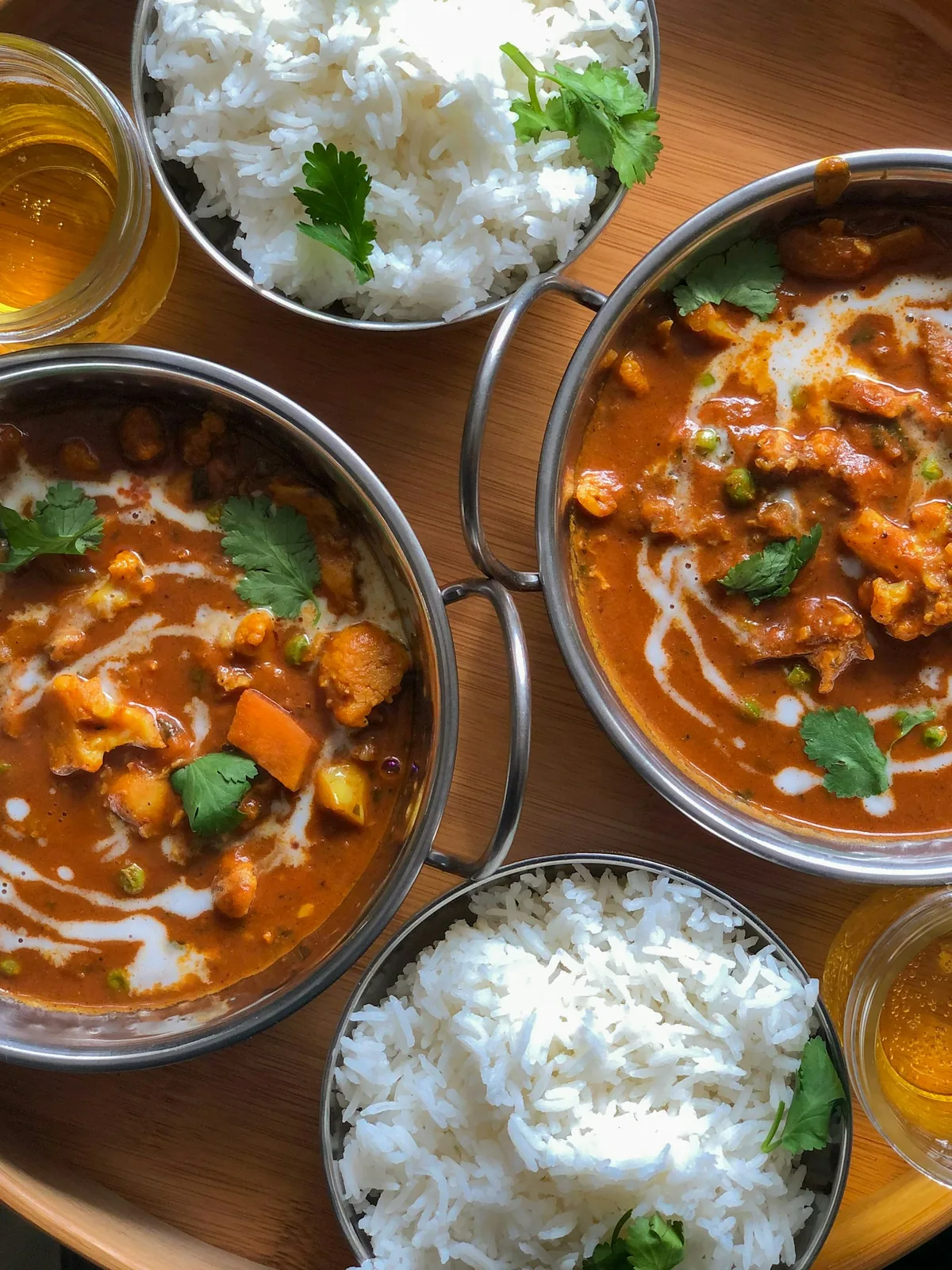Colorful South Asian curry dishes on a table